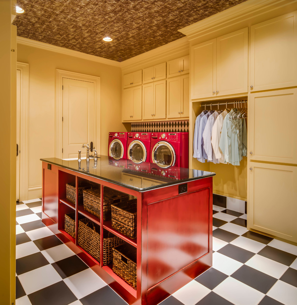 Inspiration for a large transitional ceramic tile dedicated laundry room remodel in Austin with shaker cabinets, granite countertops, yellow walls, a side-by-side washer/dryer and a farmhouse sink