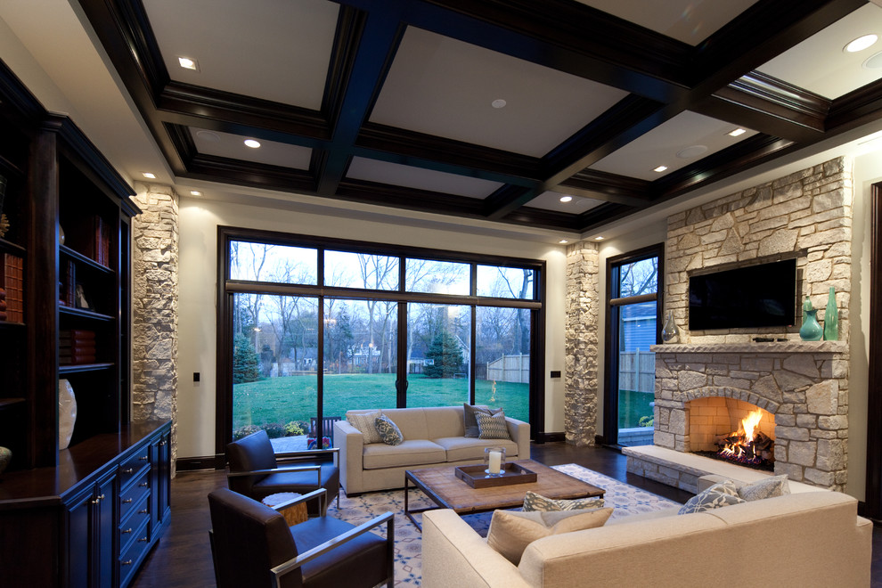 Large contemporary formal open concept living room in Chicago with beige walls, dark hardwood floors, a standard fireplace, a stone fireplace surround and a wall-mounted tv.