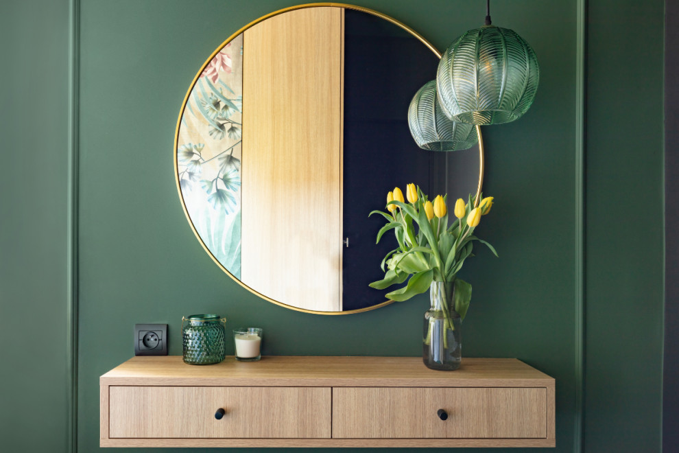 mirror hanging on wall with furniture and decor