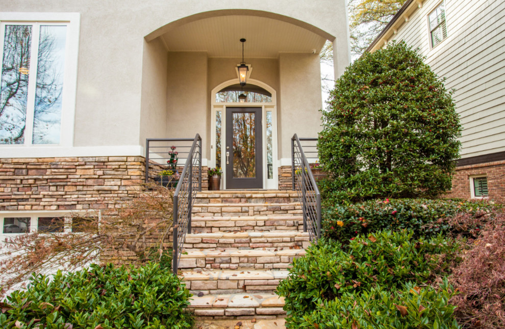 Photo of a mid-sized traditional front door in Atlanta with beige walls, a single front door and a glass front door.