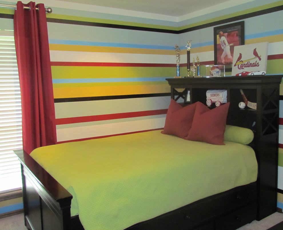This is an example of a transitional kids' bedroom in Oklahoma City with multi-coloured walls.