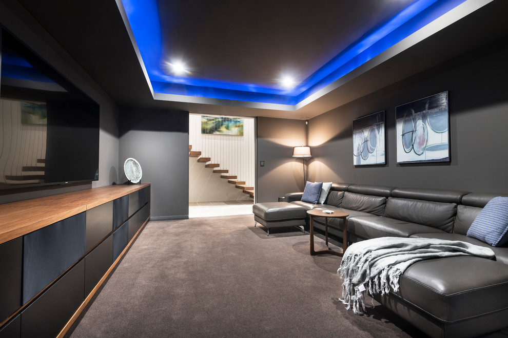 Mid-sized contemporary enclosed home theatre in Perth with grey walls, carpet, a wall-mounted tv and grey floor.
