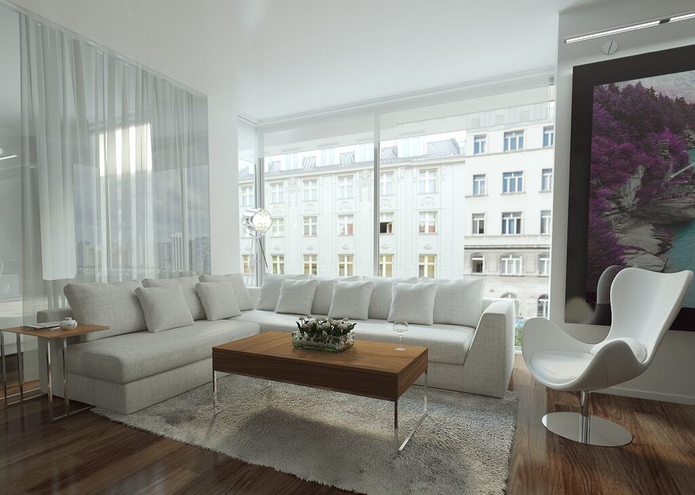 Inspiration for a contemporary loft-style living room in Miami with white walls and medium hardwood floors.