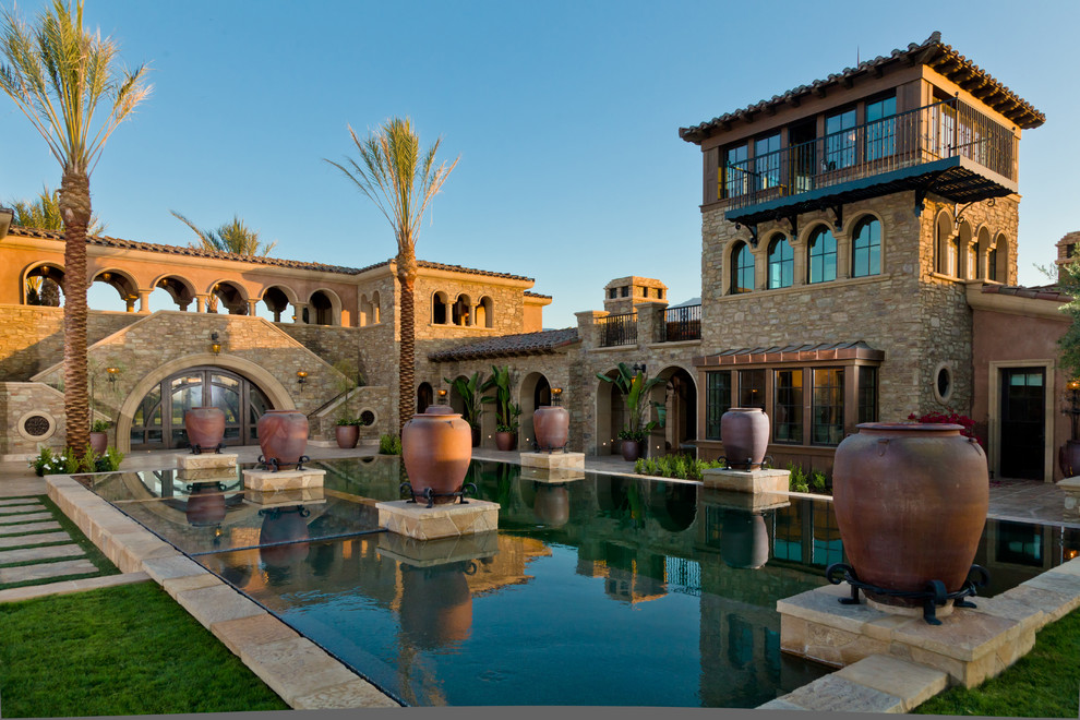 Mediterranean rectangular pool in San Diego with tile.