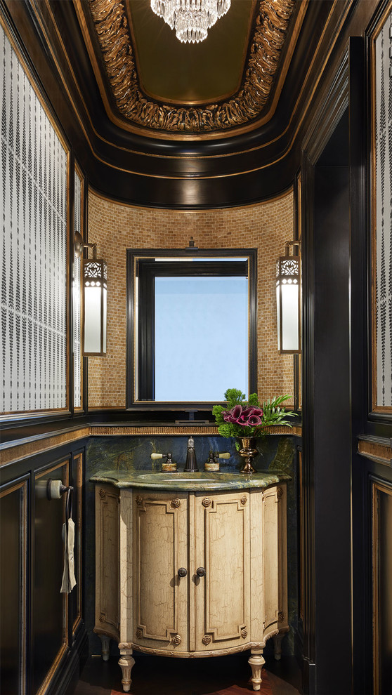 This is an example of a mediterranean powder room in Minneapolis with furniture-like cabinets, beige cabinets, dark hardwood floors, an undermount sink, brown floor and green benchtops.