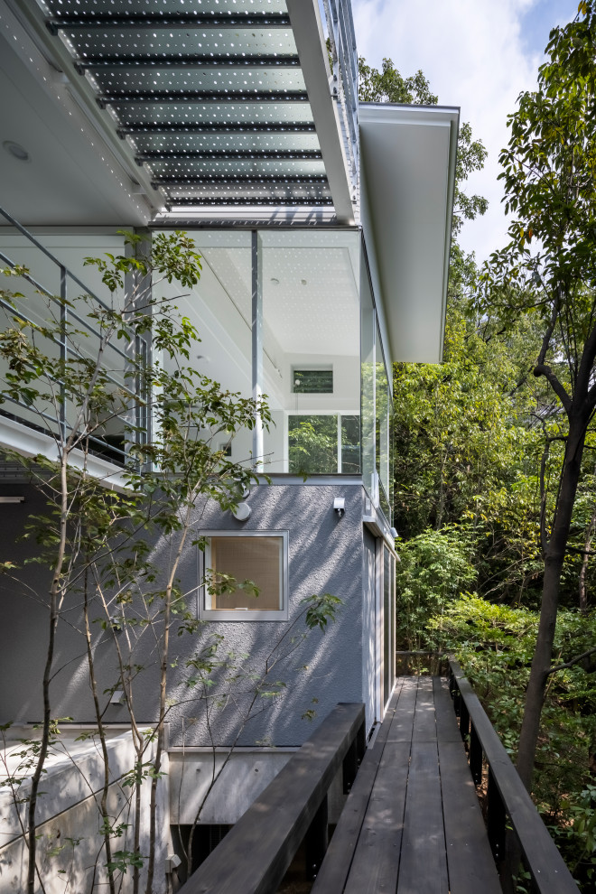 This is an example of a modern wood railing balcony in Other.