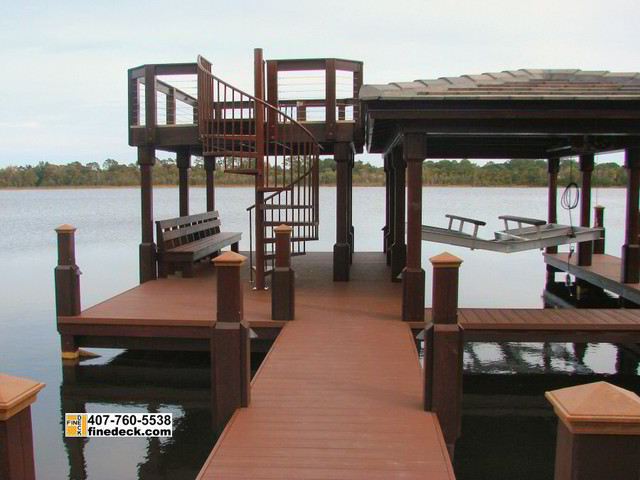 new two story dock with hip roof over a boat slip