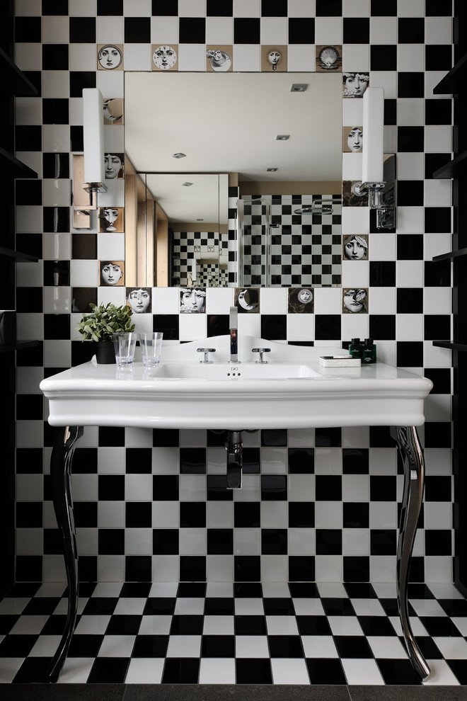 Photo of a mid-sized contemporary 3/4 bathroom in Lyon with black and white tile and a console sink.