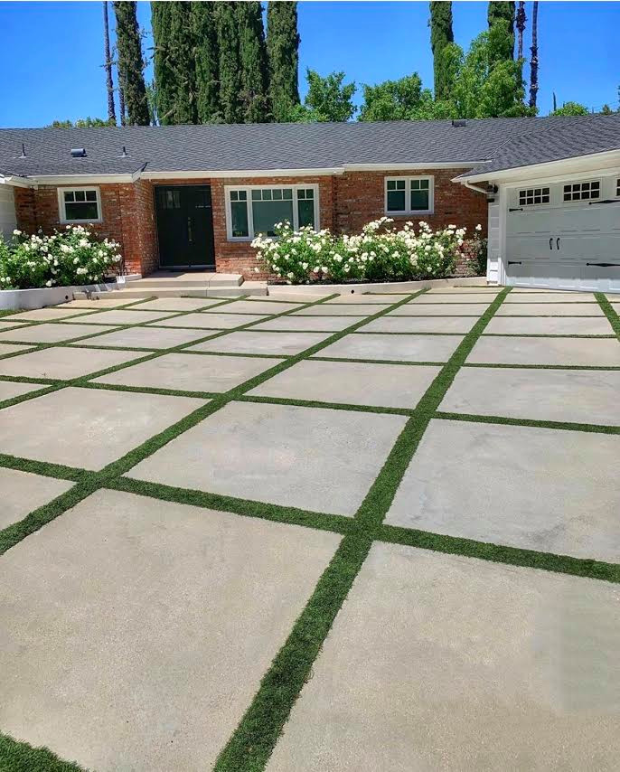 Inspiration for a large transitional front yard full sun driveway in San Diego with concrete pavers.