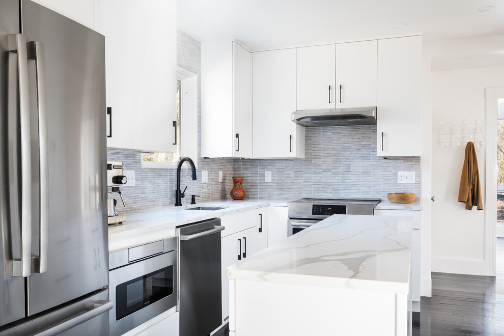 This is an example of a mid-sized modern l-shaped separate kitchen in Boston with an undermount sink, flat-panel cabinets, white cabinets, quartzite benchtops, grey splashback, porcelain splashback, stainless steel appliances, painted wood floors, with island, black floor and yellow benchtop.