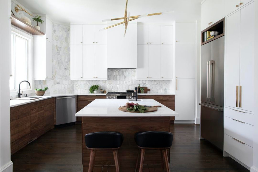 Inspiration for a large contemporary u-shaped enclosed kitchen in Los Angeles with a submerged sink, flat-panel cabinets, white cabinets, engineered stone countertops, grey splashback, porcelain splashback, stainless steel appliances, dark hardwood flooring, an island, brown floors, white worktops, a vaulted ceiling and feature lighting.