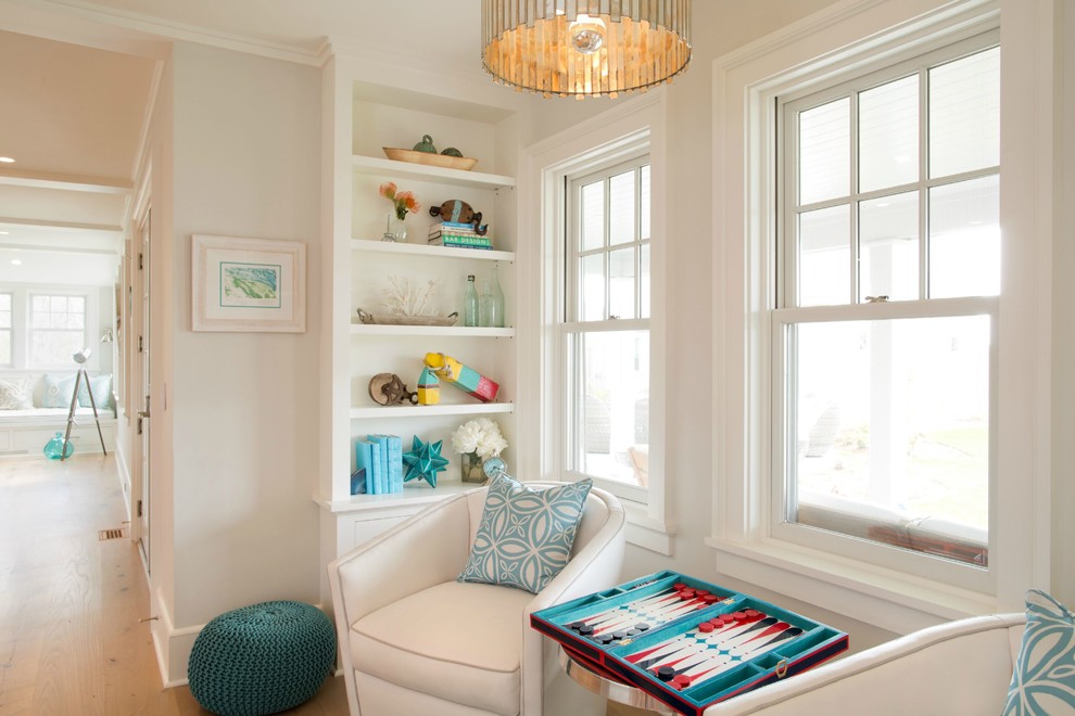 Photo of a mid-sized beach style open concept family room in Boston with white walls, medium hardwood floors and a game room.