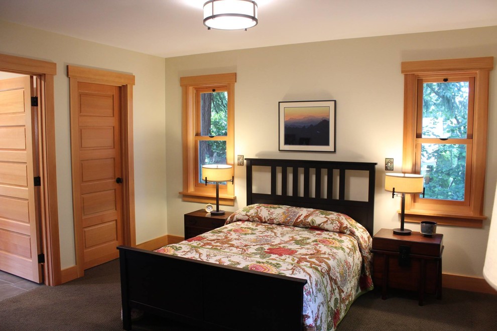 Photo of an arts and crafts master bedroom in Seattle with beige walls.