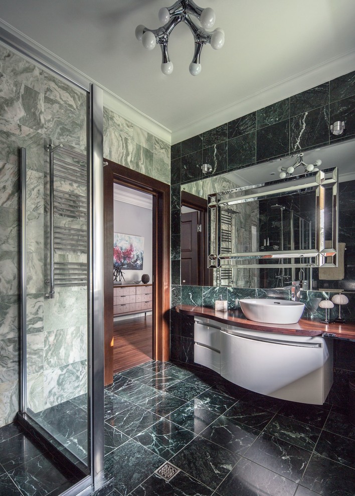 Design ideas for a mid-sized contemporary 3/4 bathroom in Moscow with flat-panel cabinets, white cabinets, a curbless shower, a wall-mount toilet, green tile, marble, green walls, marble floors, a drop-in sink, wood benchtops, green floor, a sliding shower screen and brown benchtops.