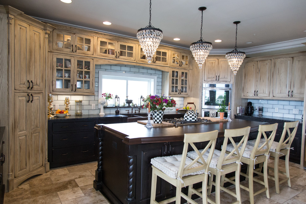 Design ideas for a large country u-shaped eat-in kitchen in Orlando with a farmhouse sink, beaded inset cabinets, distressed cabinets, granite benchtops, ceramic splashback, stainless steel appliances, porcelain floors, with island, white splashback and beige floor.