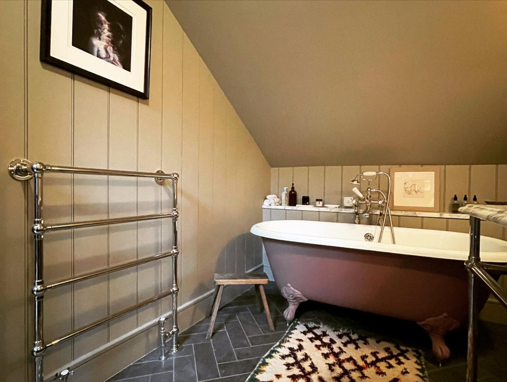 This is an example of a small arts and crafts master bathroom in London with a freestanding tub, a two-piece toilet, grey walls, porcelain floors, a wall-mount sink, marble benchtops, grey floor, white benchtops, a single vanity, a freestanding vanity, exposed beam and panelled walls.
