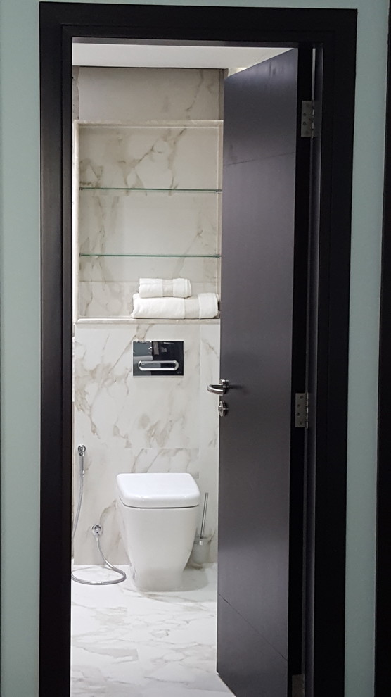 Inspiration for a mid-sized modern master beige tile and ceramic tile ceramic tile walk-in shower remodel with a two-piece toilet, a console sink and marble countertops