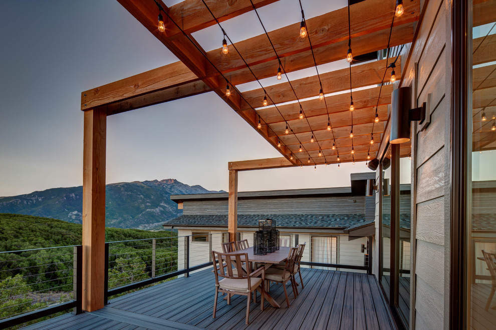 Inspiration for a contemporary backyard deck in Salt Lake City with a pergola.