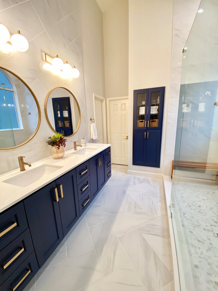 Photo of a mid-sized contemporary master bathroom in Dallas with shaker cabinets, blue cabinets, an open shower, a one-piece toilet, gray tile, porcelain tile, grey walls, porcelain floors, an undermount sink, engineered quartz benchtops, grey floor, an open shower, white benchtops, a double vanity and a floating vanity.