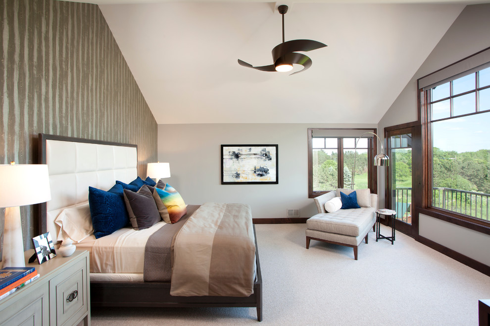 Photo of a transitional bedroom in Minneapolis with multi-coloured walls, carpet and grey floor.