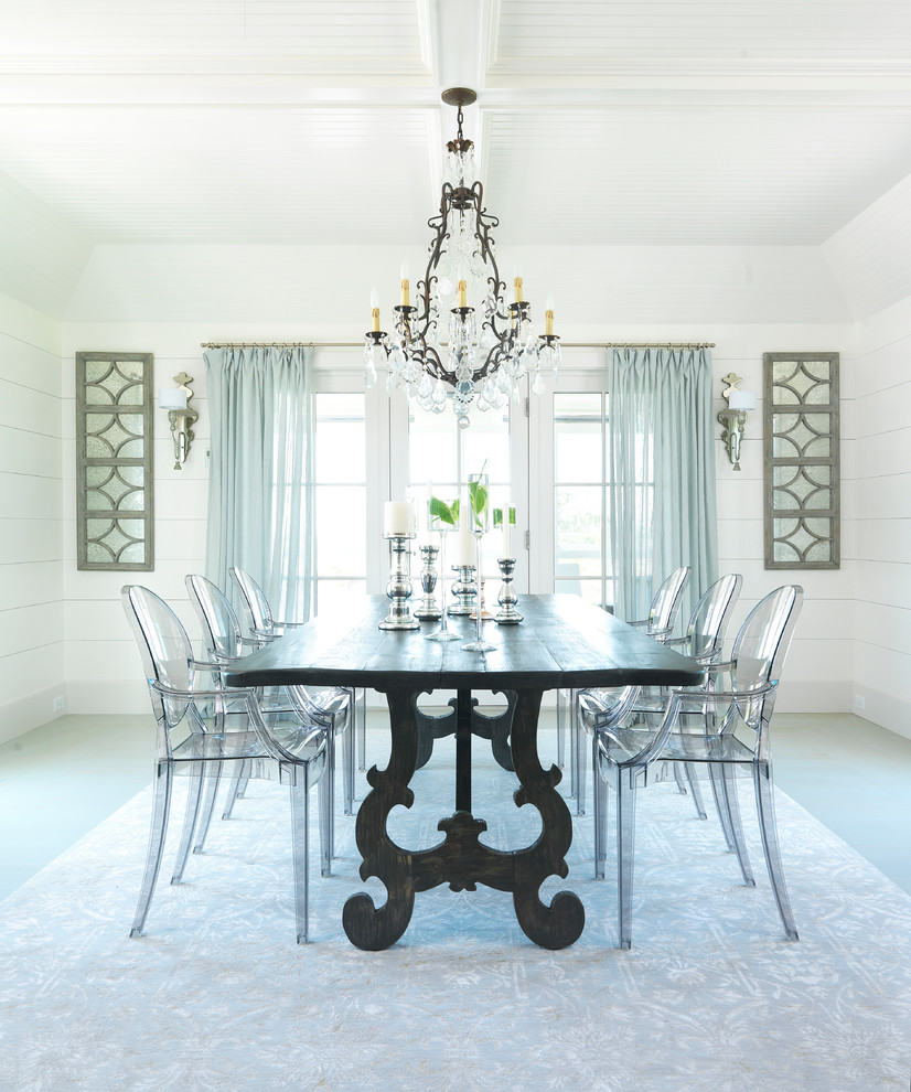 Beach style dining room in Boston with white walls.