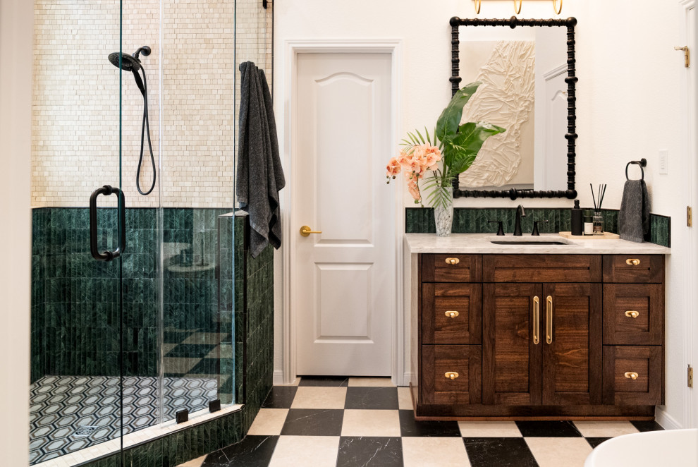 Mid-sized transitional master green tile and marble tile marble floor, black floor and double-sink freestanding bathtub photo in Austin with shaker cabinets, dark wood cabinets, green walls, an undermount sink, quartz countertops, a hinged shower door, white countertops and a built-in vanity