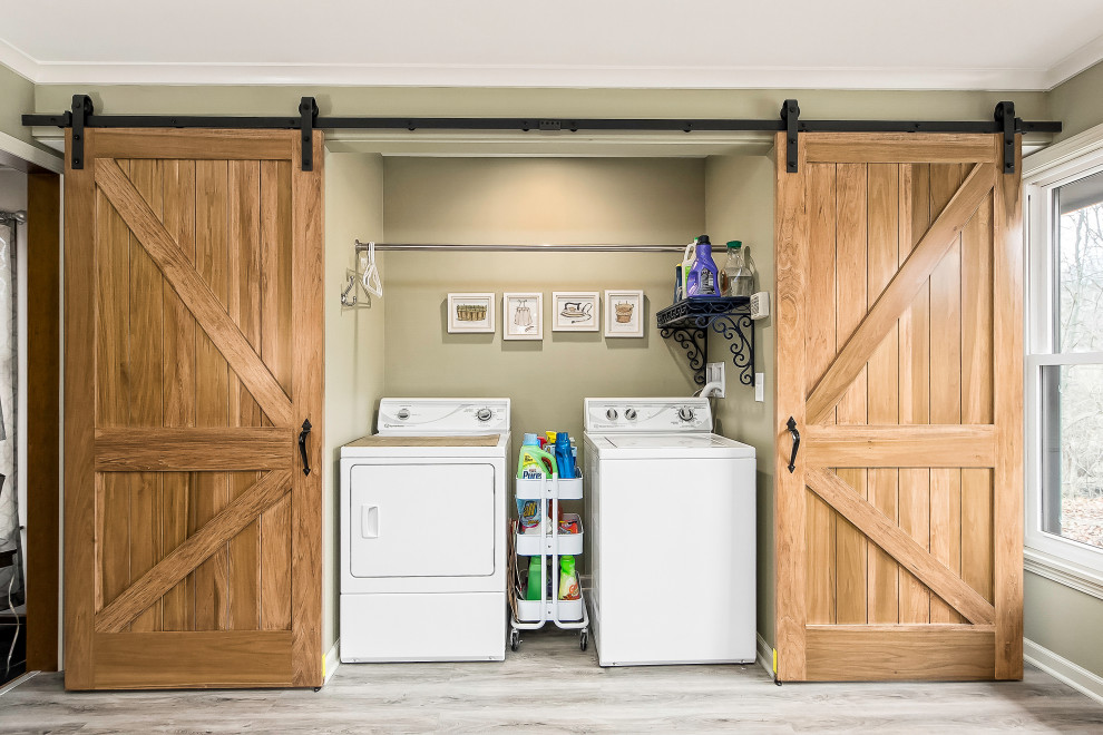 Photo of a large country laundry room in Columbus with a farmhouse sink, recessed-panel cabinets, white cabinets, quartzite benchtops, white splashback, laminate floors, grey floor and white benchtop.