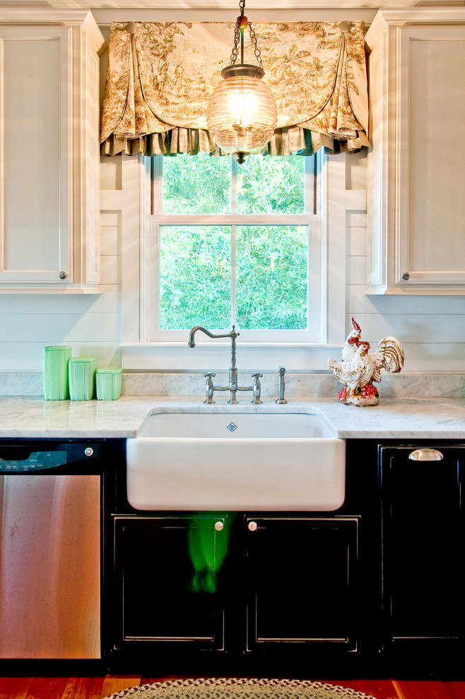 Kitchen - country kitchen idea in Charleston with a farmhouse sink, recessed-panel cabinets and black cabinets