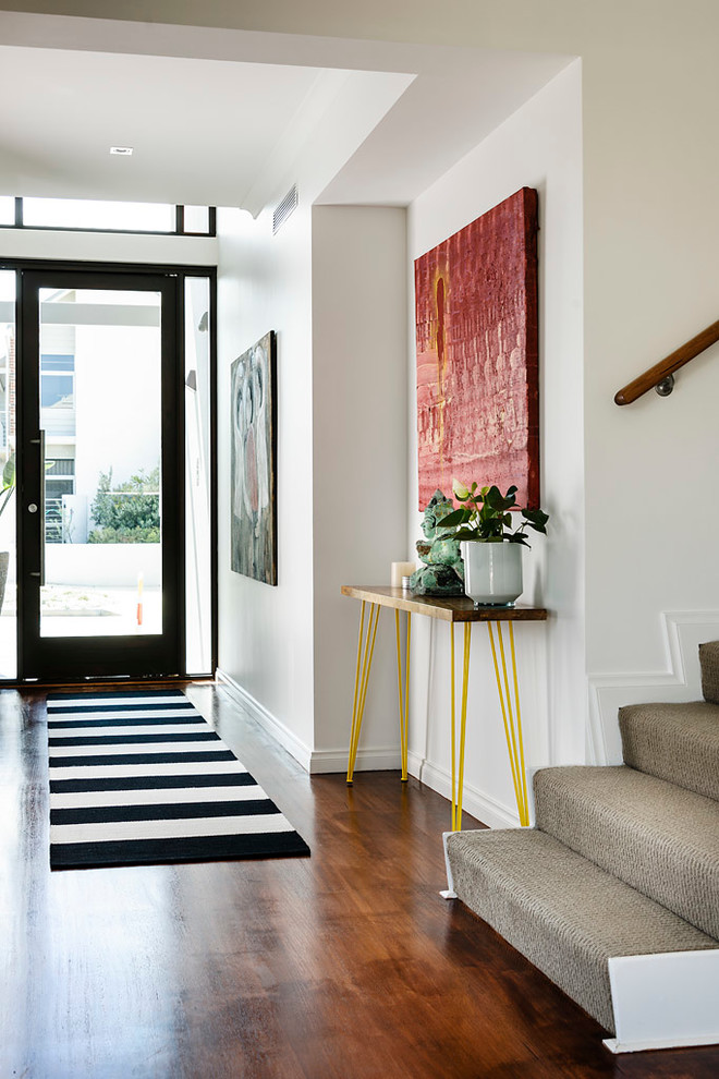 Photo of a contemporary entry hall in Perth with white walls, dark hardwood floors, a single front door and a glass front door.