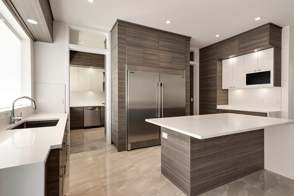 Design ideas for a large contemporary u-shaped open plan kitchen in Vancouver with an undermount sink, flat-panel cabinets, grey cabinets, quartzite benchtops, white splashback, stainless steel appliances, porcelain floors, with island, grey floor and white benchtop.