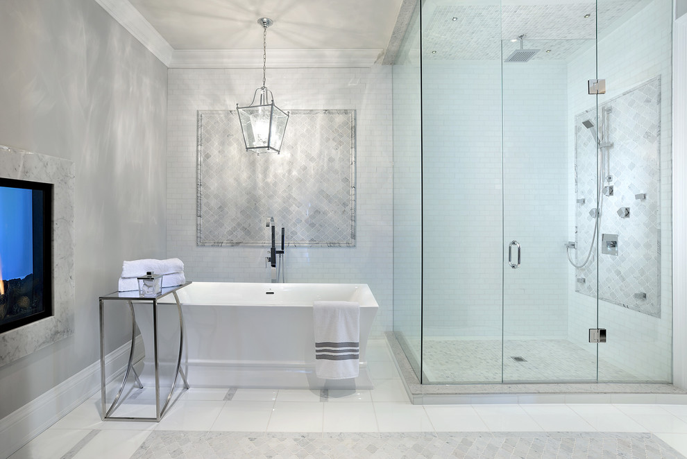 This is an example of a large contemporary master bathroom in Toronto with a freestanding tub, a corner shower, gray tile, white tile, ceramic tile, grey walls and marble floors.