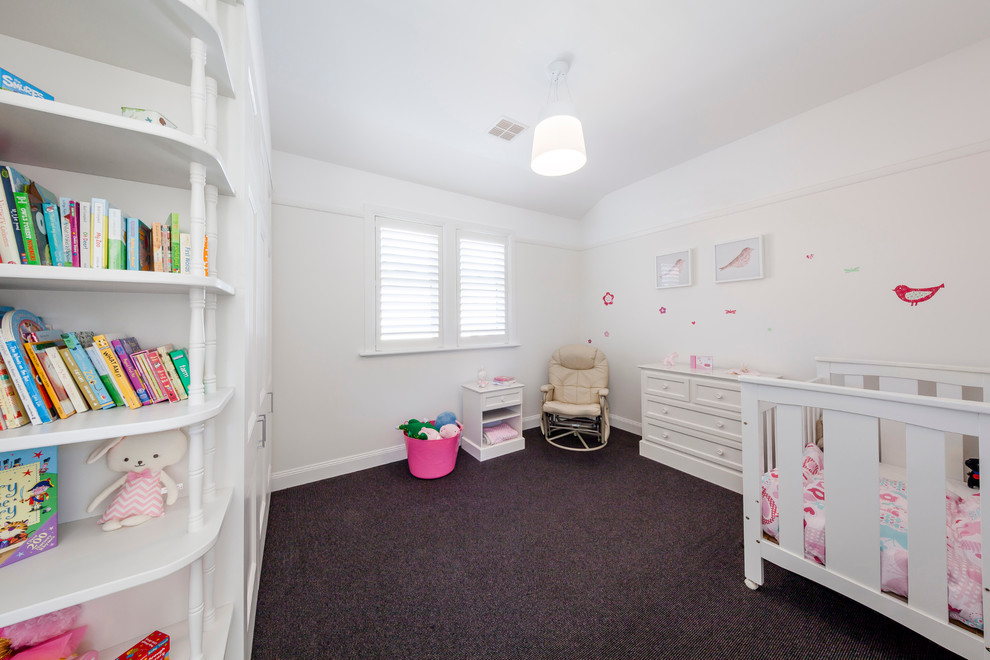 Design ideas for a mid-sized contemporary kids' room for girls in Melbourne with white walls and carpet.
