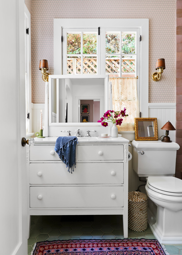 Inspiration for a mid-sized eclectic kids bathroom in Los Angeles with furniture-like cabinets, white cabinets, an alcove shower, a two-piece toilet, ceramic floors, an undermount sink, marble benchtops, green floor, a hinged shower door, white benchtops, a shower seat, a single vanity, a freestanding vanity and panelled walls.