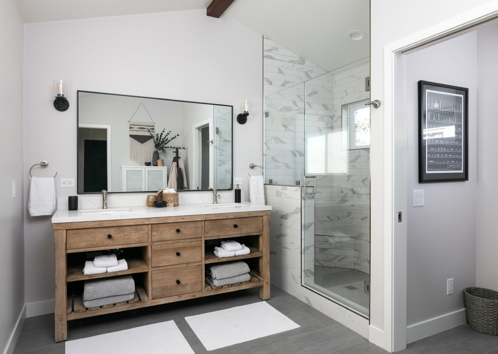 This is an example of a contemporary master bathroom in Los Angeles with flat-panel cabinets, medium wood cabinets, grey walls, an undermount sink, engineered quartz benchtops, grey floor, a hinged shower door, white benchtops, a double vanity, a built-in vanity, exposed beam and vaulted.