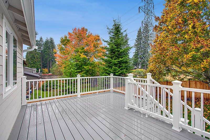 Transitional backyard deck photo in Seattle
