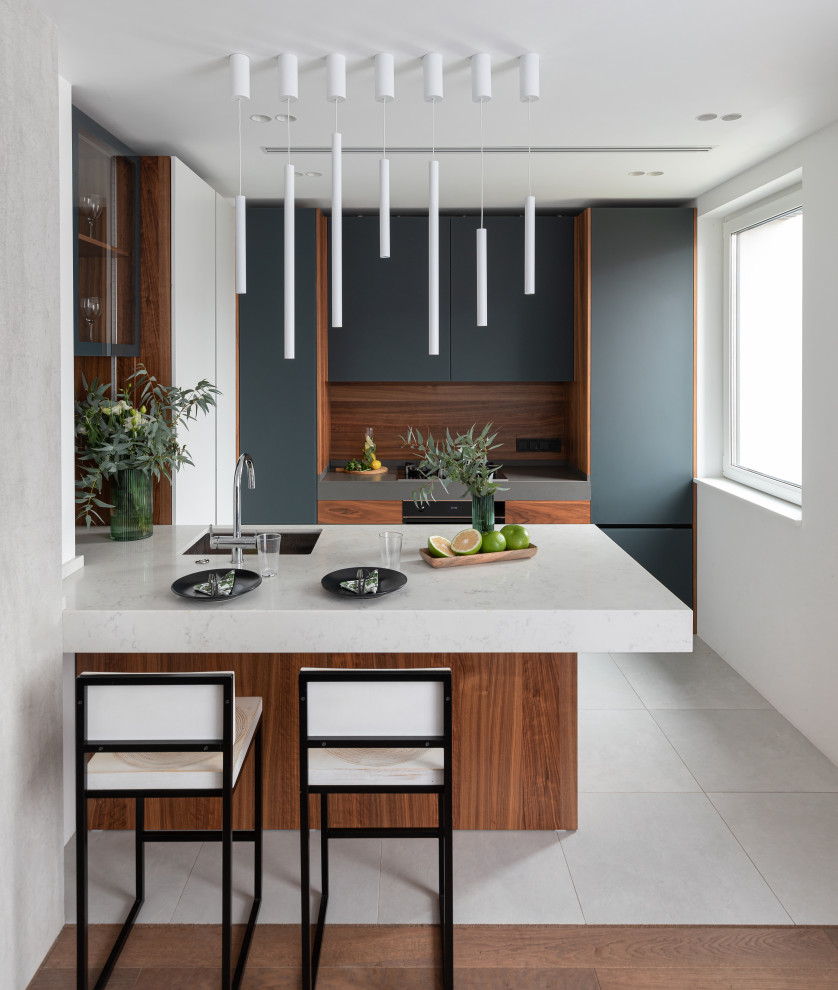 Mid-sized contemporary u-shaped eat-in kitchen in Moscow with a single-bowl sink, black cabinets, quartz benchtops, brown splashback, timber splashback, panelled appliances, with island, grey benchtop, flat-panel cabinets and grey floor.
