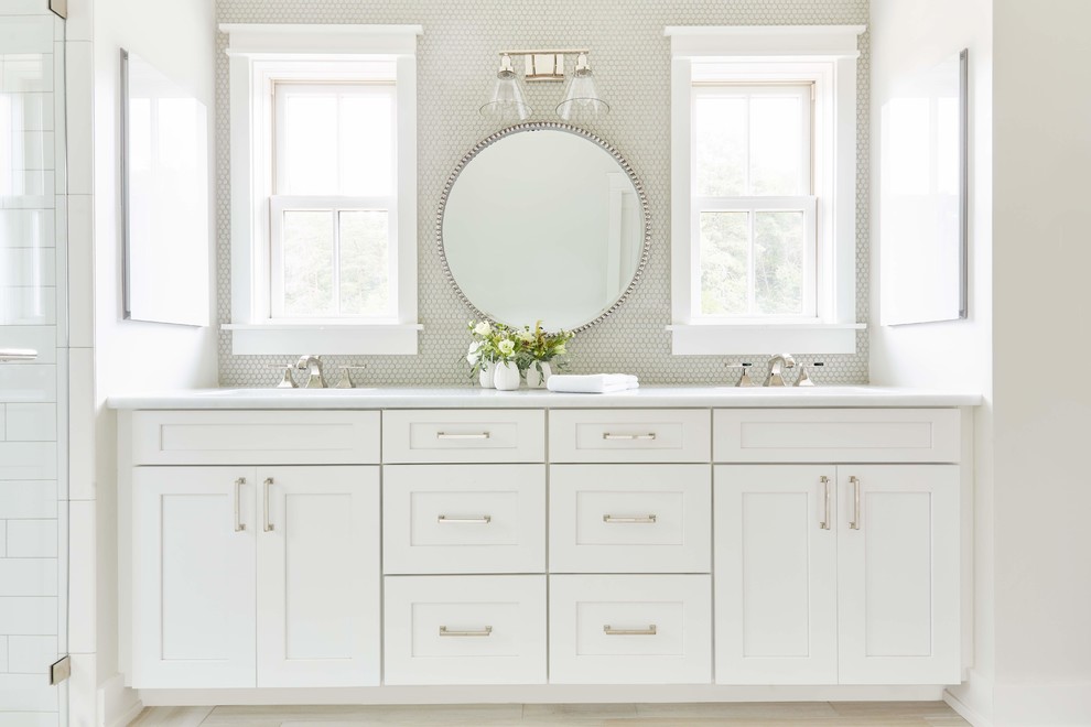 Rockville - Example of a large cottage master white tile and mosaic tile light wood floor and beige floor alcove shower design in Richmond with shaker cabinets, white cabinets, white walls, white countertops, a two-piece toilet, an undermount sink, quartzite countertops and a hinged shower door