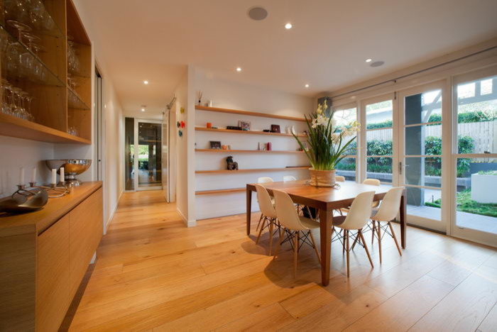 Inspiration for a traditional dining room in Brisbane with light hardwood floors.