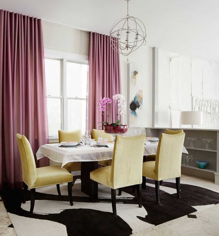 Inspiration for a transitional dining room in Chicago with white walls.