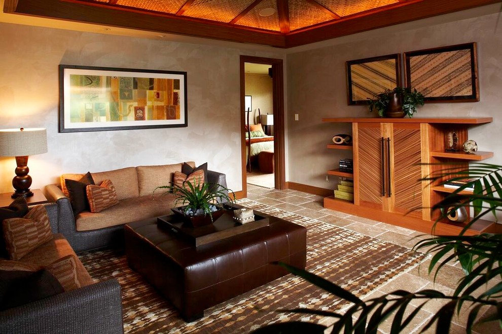 Design ideas for a tropical living room in Hawaii with grey walls.