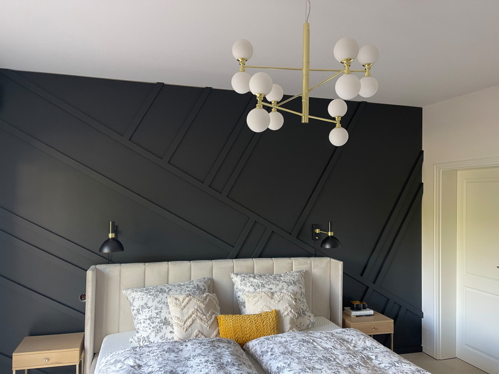 This is an example of a mid-sized eclectic master bedroom in Other with black walls, porcelain floors, beige floor and wood walls.