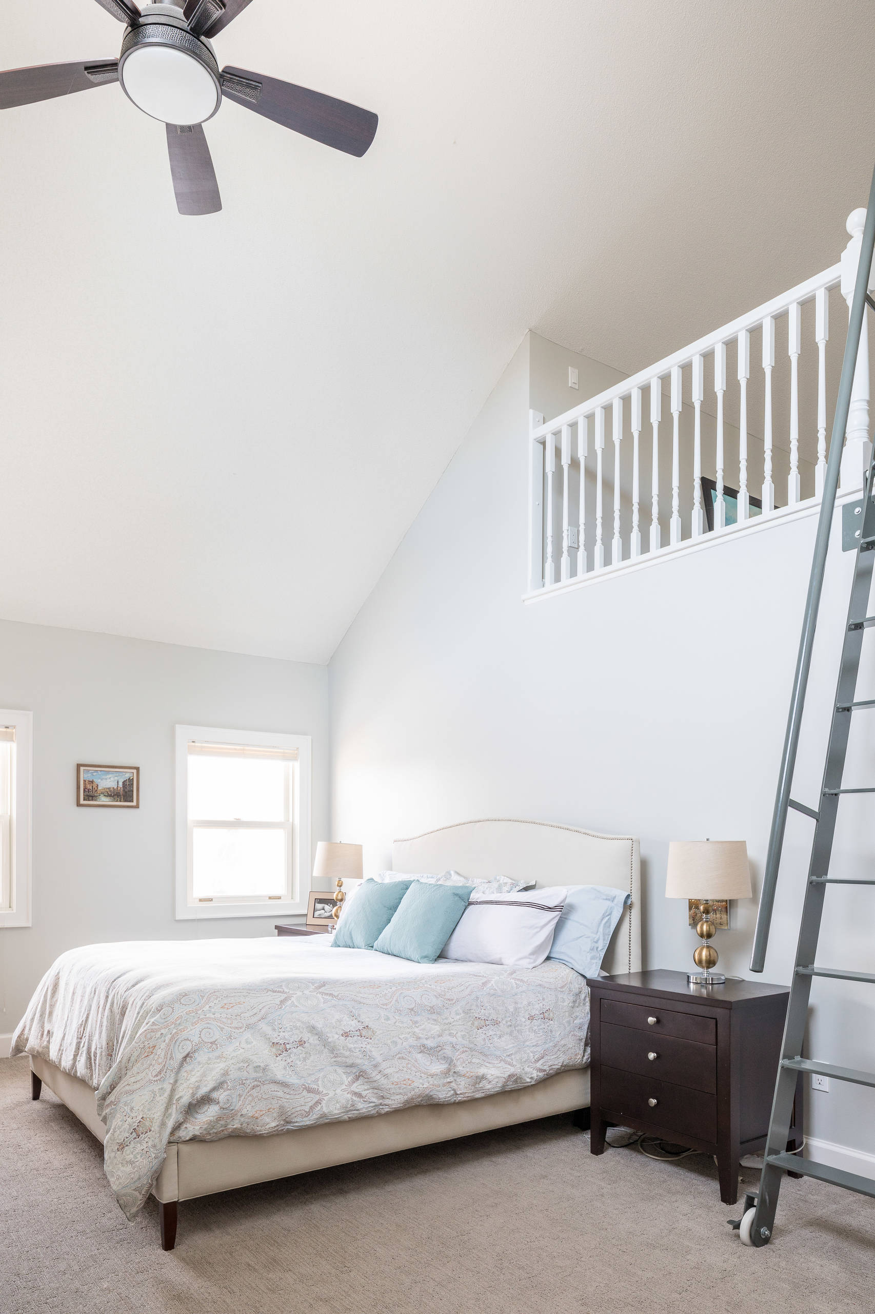 Principal Bedroom with custom rolling ladder to loft