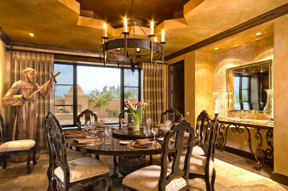 Photo of a mediterranean dining room in Phoenix with yellow walls.
