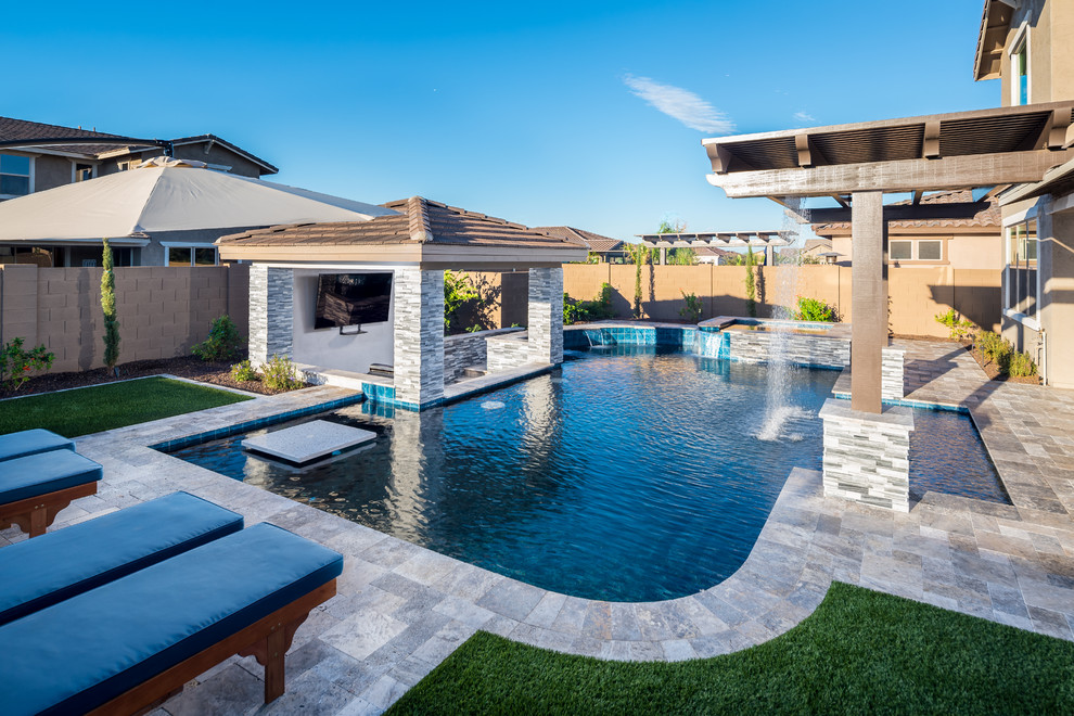 Transitional backyard custom-shaped pool with a water feature.