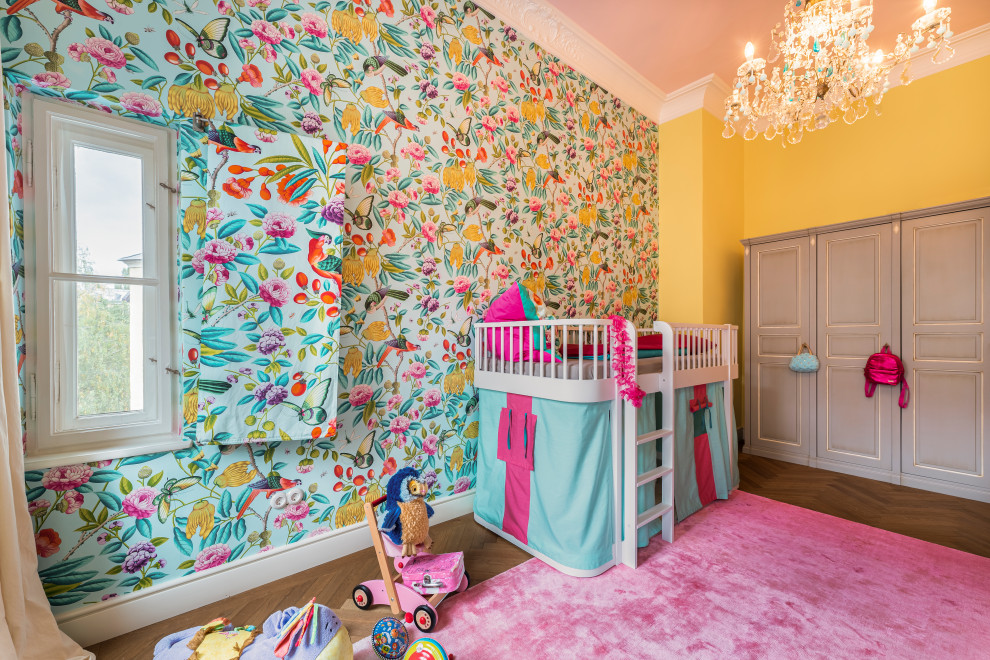Large eclectic gender-neutral kids' room in Munich with yellow walls, medium hardwood floors, brown floor and wallpaper for kids 4-10 years old.