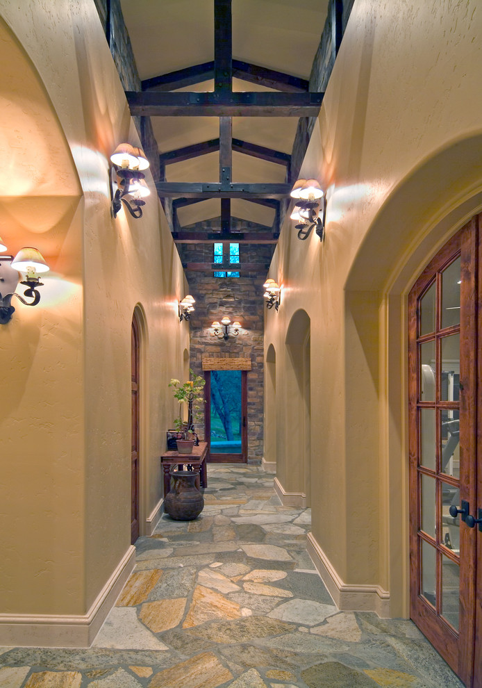 Inspiration for a mediterranean hallway in Sacramento with beige walls.