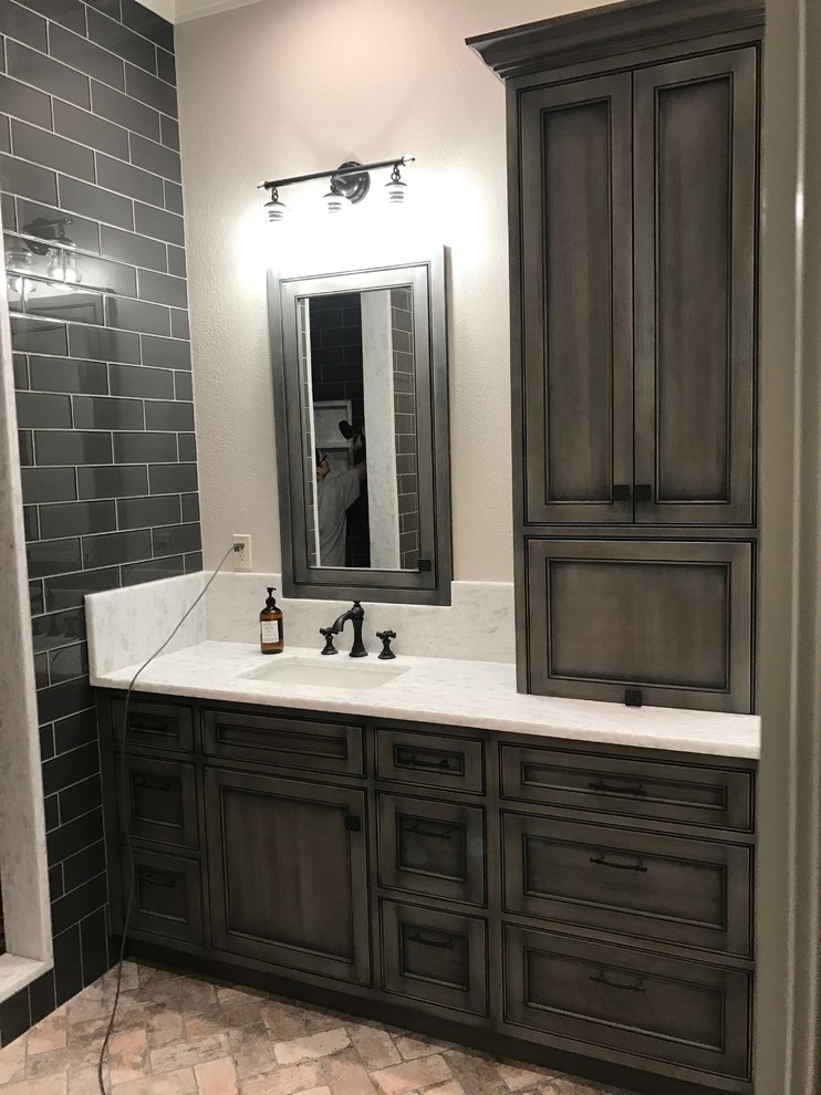 Design ideas for a large beach style master bathroom in Detroit with beaded inset cabinets, grey cabinets, grey walls, brick floors, an undermount sink, quartzite benchtops and grey floor.
