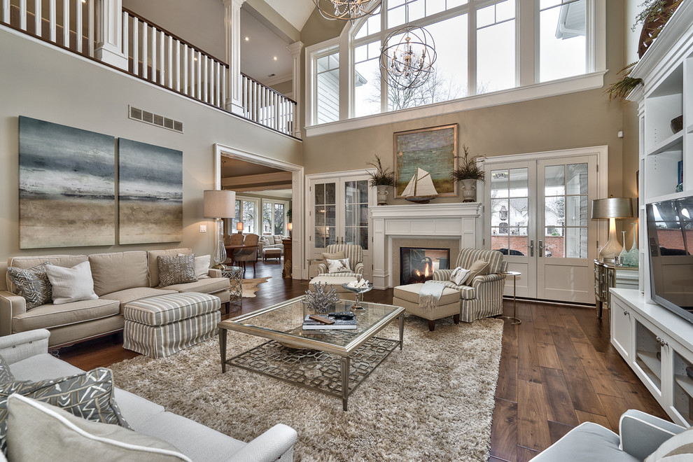 Large transitional open concept living room in Toronto with beige walls, dark hardwood floors, a two-sided fireplace, a tile fireplace surround and a built-in media wall.