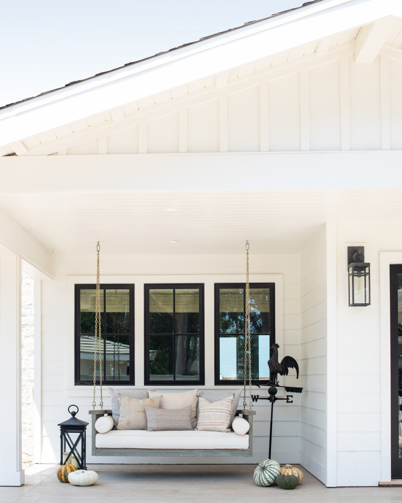 Inspiration for a country verandah in Los Angeles with a roof extension.