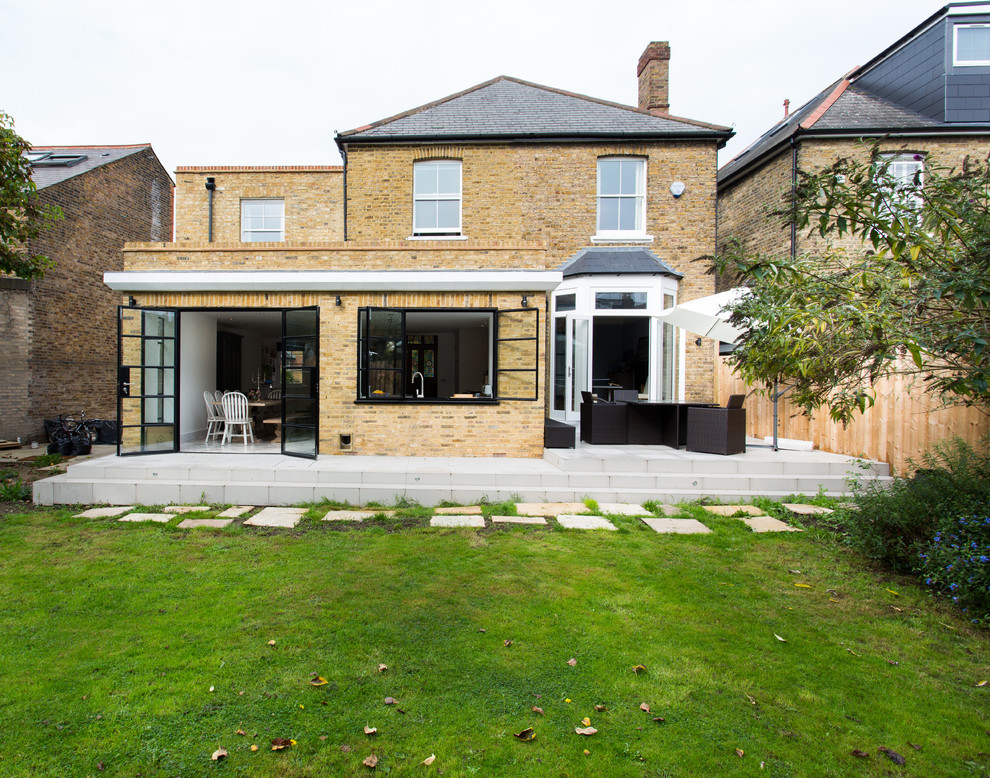 Design ideas for a medium sized classic bungalow brick house exterior in London.